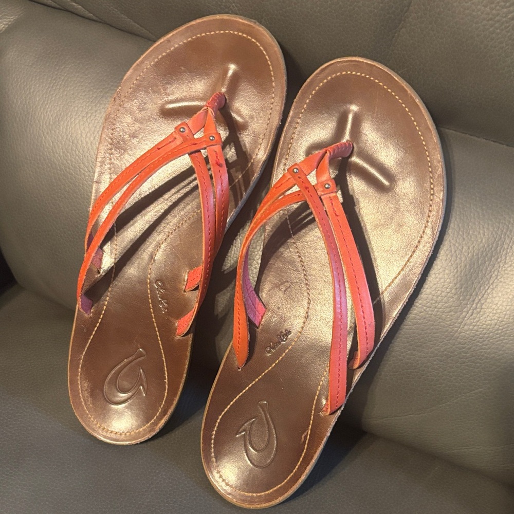 Women’s Brown Leather Thong Sandals with orange straps.